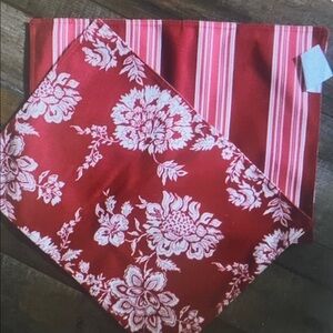 2 red and white place mats.